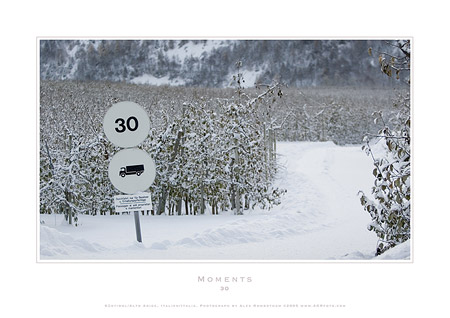 AGRfoto_2_6531 - 30 km speed sign on road which is inaccessible due to too much snow. Alto Adige, Italy