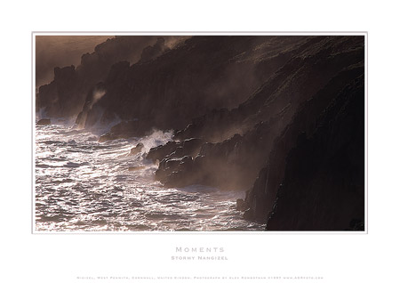 AGRfoto_B645_04 - Song of the Sea - photographic print by Alex Rowbotham.  Nanjizel (Mill Bay or Nanjizal) is a beach and cove situated one mile to the south-east of Land's End, Cornwall, UK.  Nanjizel has no direct access via road and is usually reached via the South West Coast Path by walking from Land's End, and so is often very quiet. Nanjizel is also a noted bird and seal watching location.  Nanjizel can vary from a beautiful sandy beach to a stony cove, all at the whim of the sea. It faces due west out to the Atlantic. To the south is the 'Song of the Sea', where the sea has worn through a narrow passageway from the cove to the ocean.  Due to it's relative inaccessibility, Nanjizel has remained more or less untouched and never gets busy. Situated at the end of a short, shallow valley, the beach is a pretty boulder strewn cove with unusually clear water. The beach used to be much more sandy but after storms around 20 years ago much of it was washed away.  This image was used in a museum installation to help illustrate the atmosphere of the Jurassic period.