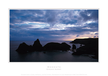 AGRfoto_B645_05 - Kynance Sunset - photographic print by Alex Rowbotham  Kynance and other nearby beaches and coves have serpentine rock formations. The rocks of green and red serpentine, polished by the sea over thousands of years are distinctive to Kynance Cove and the Lizard Peninsula. The serpentinites are actually the metamorphosed and deformed remains of the upper layers of the mantle. The metamorphosis has in most cases taken the form of ductile deformation and serpentinization. Pre-deformation they would have been in the form of lherzolite peridotite and depleted harzburgite mantle.  The boundary between these two types of serpentinite can be studied at Kynance Cove, and geologically represents the boundary between shallow mantle peridotites from which material has been extracted by melting and deeper peridotite from which no material has been removed.